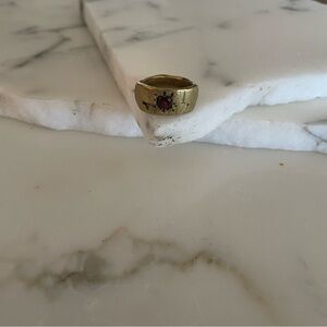 Brass ring with a garnet